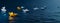 Yellow Paper Boat Leading White Boats in Dark Blue Background
