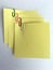 Yellow paper notes binden with staples. Notes and staples.