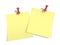 Yellow paper pinned to a white background