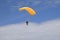 Yellow parachutist man enjoys his first flight