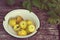 Yellow paradise apples in a bowl on wooden  in garden
