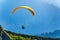 Yellow paraglider over the Green Mountain slope