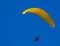 Yellow paragliding on flight