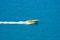 Yellow parasailing boat in the sea