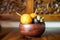 Yellow passion fruits and mangosteen in wooden bowl.