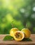 yellow passionfruit on wood with a blurred green background