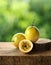 yellow passionfruit on wood with a blurred green background