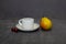 Yellow pear on a grey background, cherry and coffee Cup