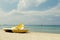 Yellow pedal boats on a turquoise beach in Greece and lines with red buoys