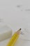 Yellow pencil White eraser and eraser leftovers white background