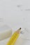 Yellow pencil White eraser and eraser leftovers white background