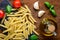 Yellow Penne Pasta and Cooking Ingredients