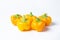 Yellow pepper on a white background. Several yellow peppers lie next to each other.