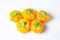 Yellow pepper on a white background. Several yellow peppers lie next to each other.