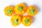 Yellow pepper on a white background. Several yellow peppers lie next to each other.