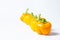 Yellow pepper on a white background. Several yellow peppers lie next to each other.