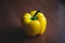 Yellow pepper on wooden table at home