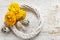 Yellow persian buttercup flowers (ranunculus) on wooden background.