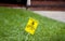 Yellow Pesticide Application Warning On Green Lawn