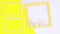 Yellow photo frame with flowers and two white frames appear. Stop motion