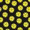 Yellow pickleballs pattern on black  background
