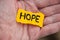 Yellow piece of paper with the word Hope