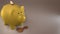 Yellow piggy bank with cryptocurrencies, golden physical coins, Ripple, Zcoin, Bitcoin and Etherium. Mining cryptocurrency