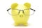 Yellow piggy bank with glasses