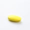 Yellow pill  on  white background