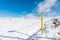 Yellow pillar, gas pointer on the slope of a snowy mountain