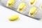 Yellow pills  on  white background