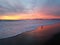 Yellow pink red purple sunset over the beach with birds 4k