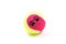 A yellow and pink tennis ball