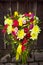 Yellow and pink wedding bouquet on a dark background