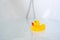 Yellow playful rubber duck float in the bathtub. Kids bath time concept. Funny toy for kits