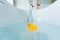 Yellow playful rubber duck float in the bathtub. Kids bath time concept. Funny toy for kits