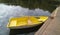 Yellow pleasure boat in the pond. Rowing boat.