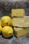 Yellow, plump quinces, arranged on the counter, quince fruit and long-maturing cheeses, montasio cheese and asiago cheese, Italian