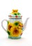 Yellow porcelain teapot with ornament flowers and butterfly.