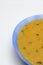 Yellow porridge in a blue plate