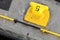Yellow port mooring bollard with number 5 label