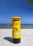 Yellow post box under deep blue Cyprus skies