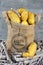 Yellow potatoes in a jute bag