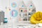 Yellow pouf in colorful child`s room interior with lamps and pos