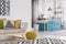 Yellow pouf in spacious room