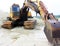 Yellow powerful excavator on a sandy quarry