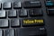 Yellow Press enter key on the black pc keyboard. Concept of disinformation, lies and hoax in the media. Spread false information