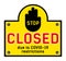 Yellow prohibition sign, sticker on the door, with the inscription STOP CLOSED due to COVID-19 restrictions