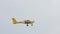 Yellow propeller plane flight Aeroprakt A-22 flying sky. Pilot fly aircraft A22