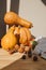 Yellow pumpkins on a light background with red apples. Autumn composition. Halloween background